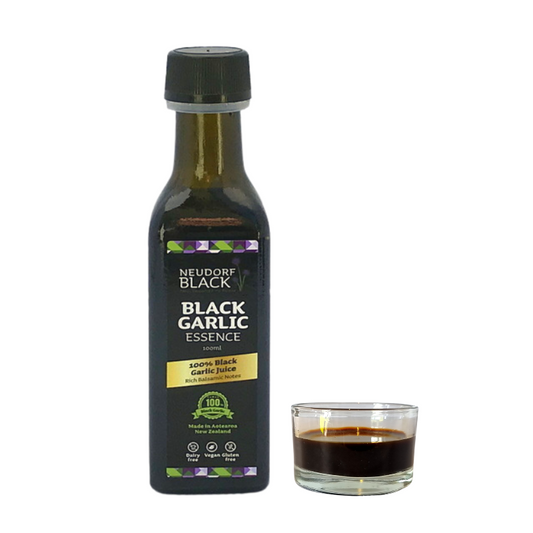 Close-up of Black Garlic Essence bottle with rich black liquid gold inside – sweet and savoury umami glaze alternative