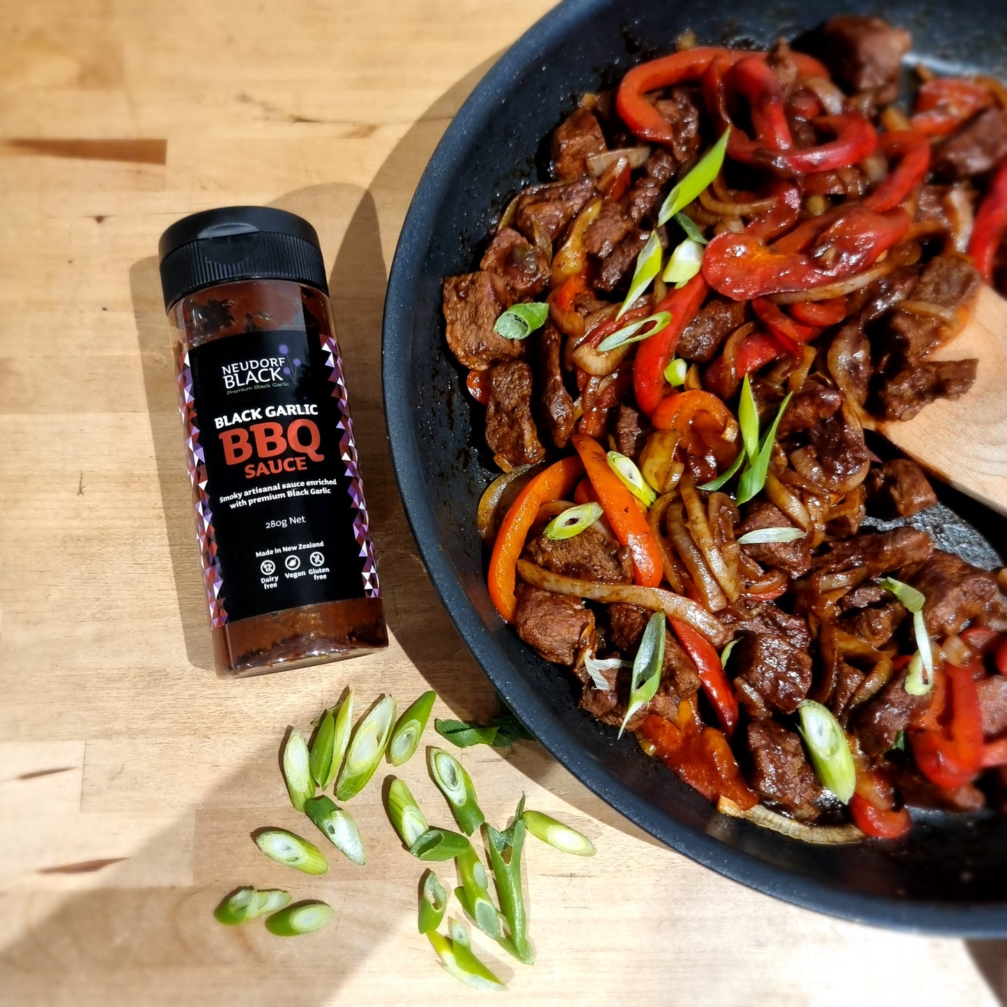 Neudorf Black Garlic BBQ sauce beside BBQ beef stirfry