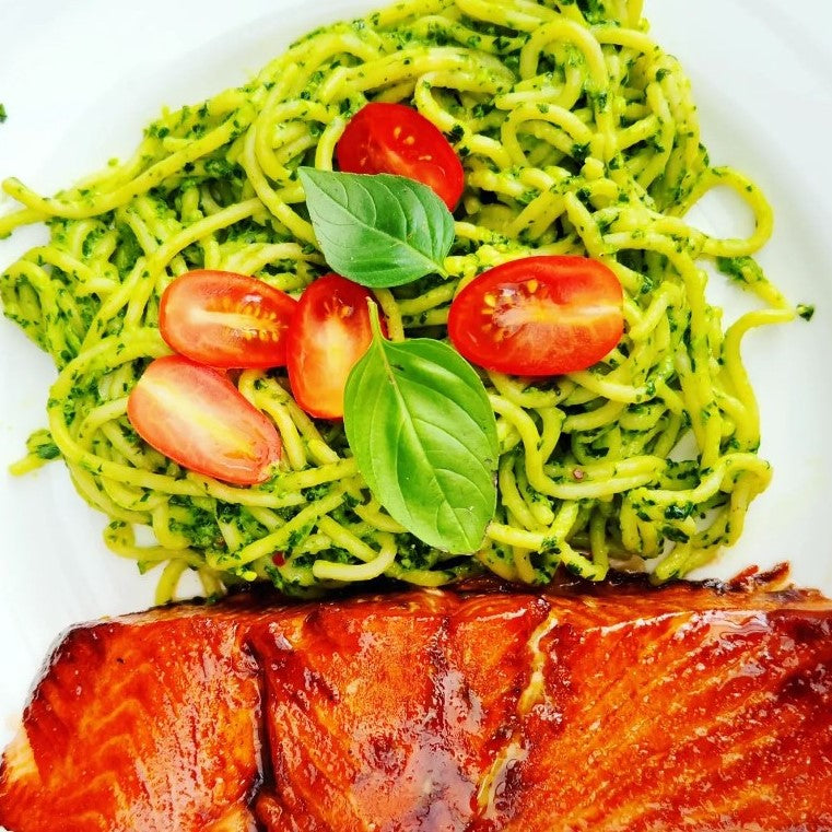 green spaghetti with cherry tomatoes