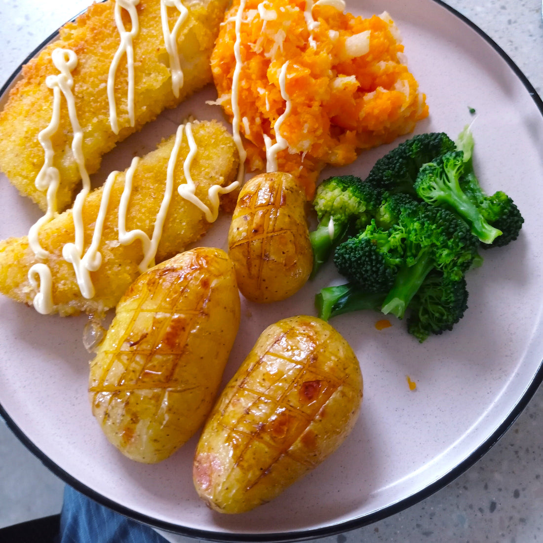 fish, potatoes and vegetables on a plate