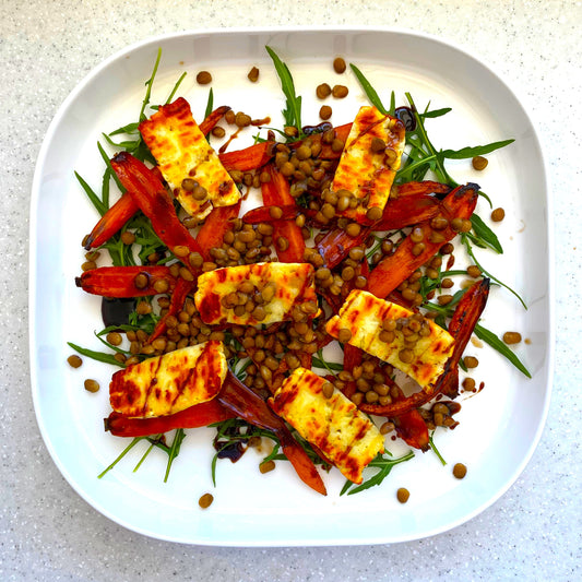 black honey roasted carrot and halloumi salad on a plate