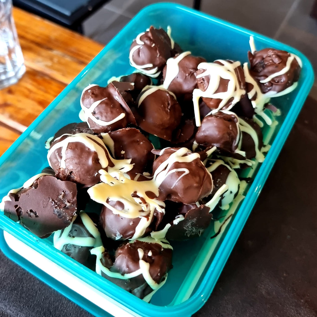 Chocolate oreo balls in a container