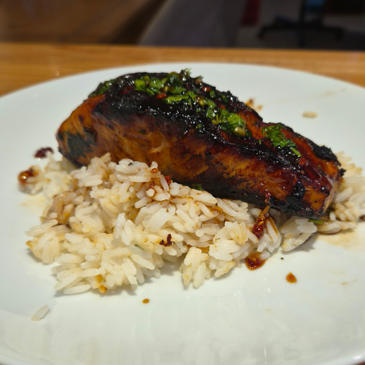coriander and black garlic salmon fillet on rice