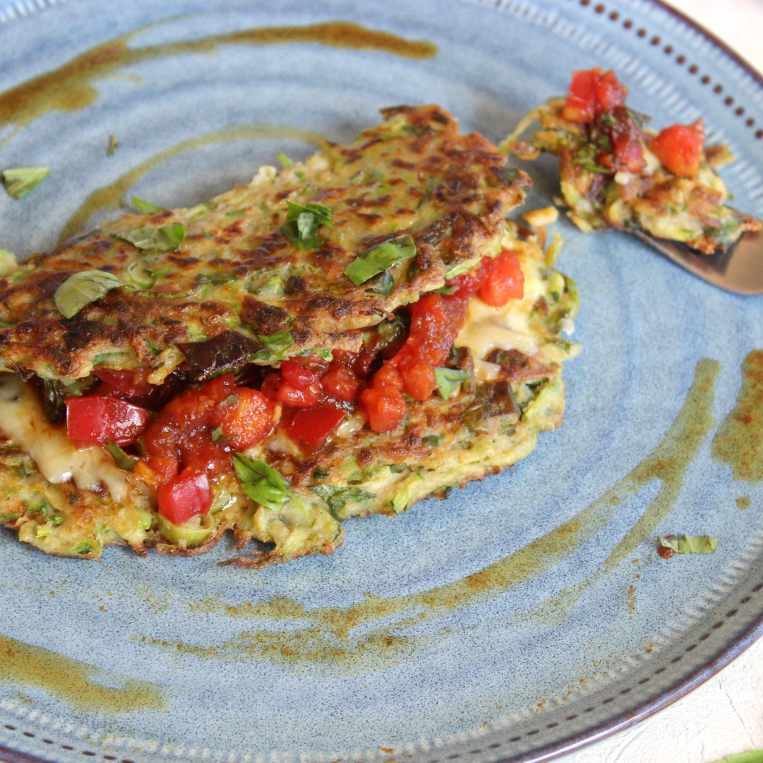 zucchini rosti filled with tomato and black garlic salsa