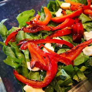 red peppers on green salad