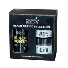 black garlic honey tube, black garlic puree jar and a jar of black garlic sea salt in a black and white presentation box