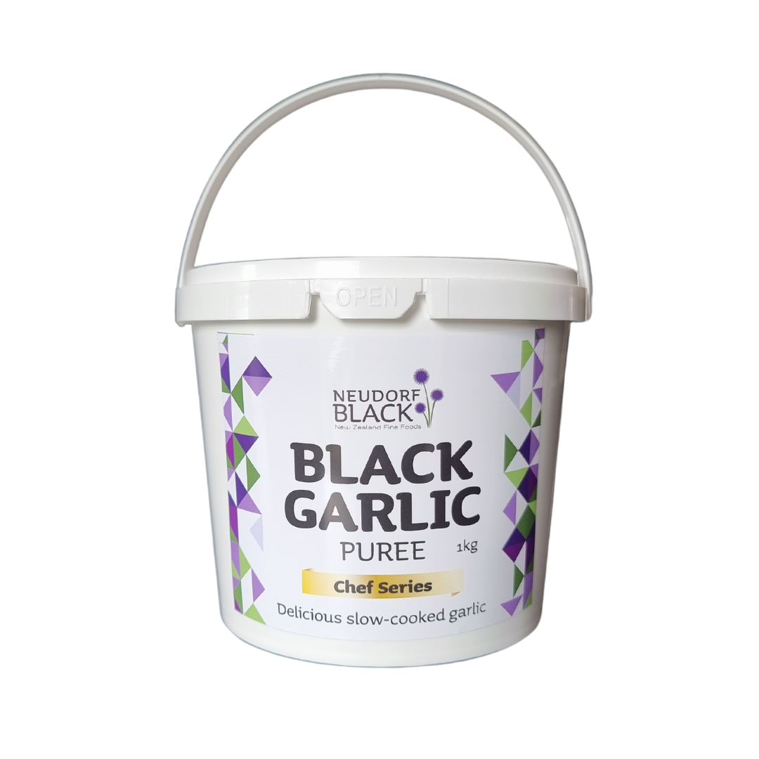 A kg white plastic tub of Neudorf Black Garlic Puree