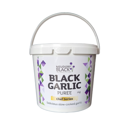 A kg white plastic tub of Neudorf Black Garlic Puree