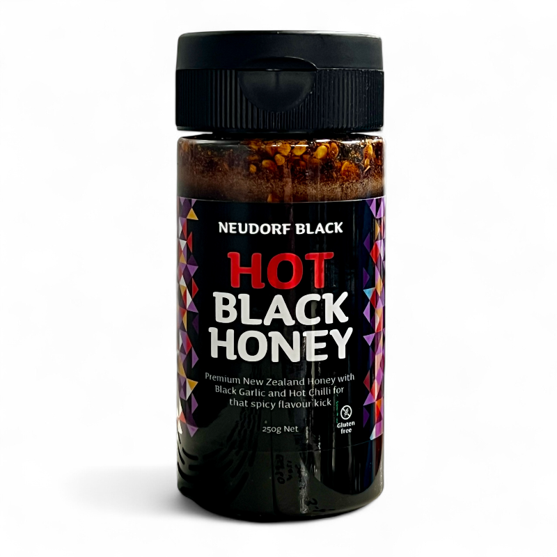 Neudorf Black Hot Black Honey squeezy tube on a white background