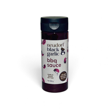a bottle of Neudorf Black Garlic BBQ Sauce on a white background