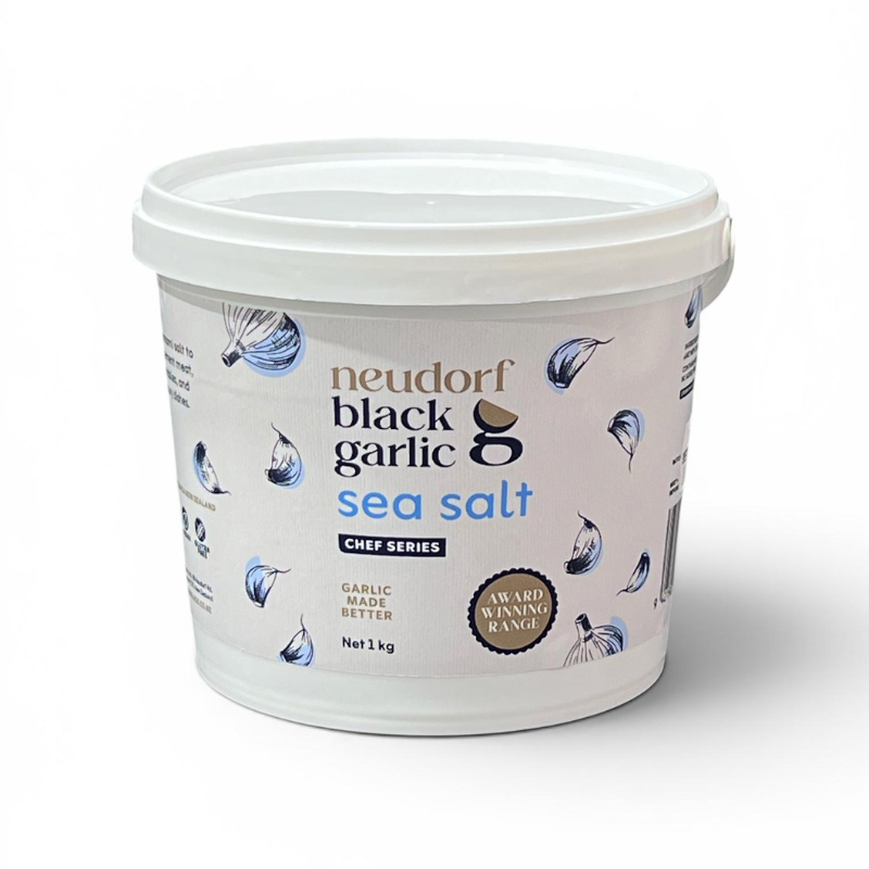 A 1 kg white plastic tub of Neudorf Black Garlic Sea Salt 