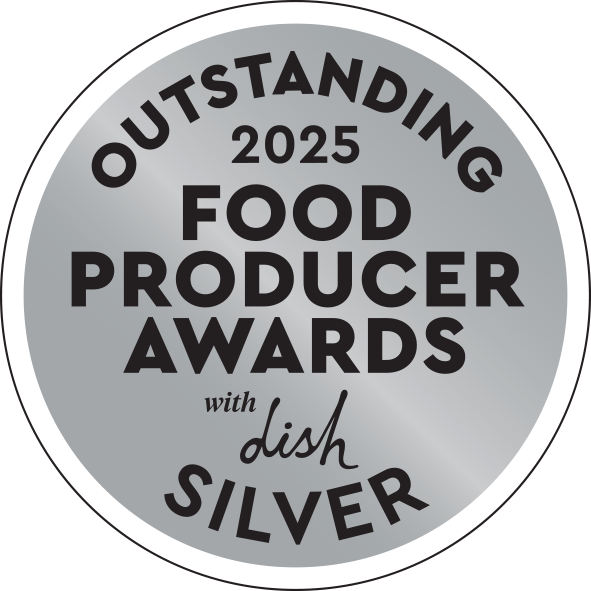 A circular silver award badge reading “OUTSTANDING 2025 FOOD PRODUCER AWARDS with dish SILVER” in black text on a white background.
