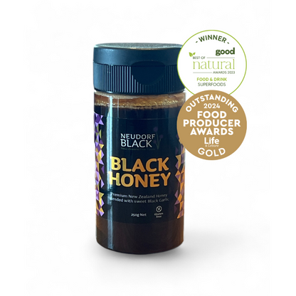 black honey tube with 2 gold awards superimposed