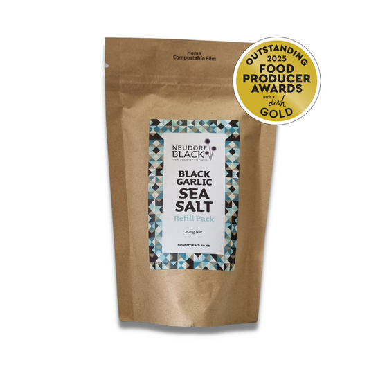 Paper refill pouch labelled with Neudorf Black Black Garlic Sea Salt and a gold award sticker